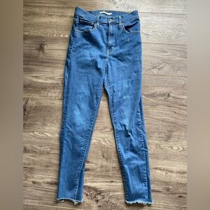 Levi’s mile high super skinny medium wash blue jeans slight crop raw hem